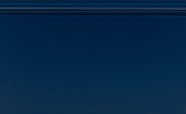 Dark blue metal panel with white label.
